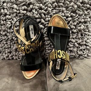 Moschino sandals , size 38.5, US size 8 1/2. Black with gold hardware.